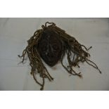 COLLECTABLES - A hand carved tribal mask with rope