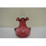 GLASS - An antique Ruby glass bottle with clear gl