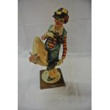 COLLECTABLES - A Capodimonte figure of a clown rea