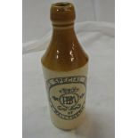 COLLECTABLES - A vintage stoneware bottle reading