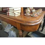 FURNITURE/ HOME - An antique mahogany end table.