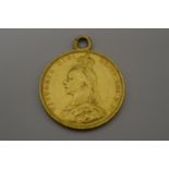 A 9CT GOLD MEDALLION IN THE SHAPE OF A SOVEREIGN