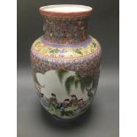 A CHINESE FAMILLE VERTE PORCELAIN VASE with shouldered tapering body. Height (excluding wooden