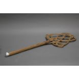 A VINTAGE CANE CARPET BEATER