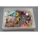 A BOX OF COSTUME JEWELLERY