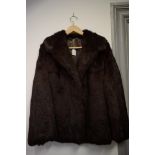 MID-LENGTH DARK BROWN FAUX-FUR 'TISSAVEL' COAT, approx size 12.