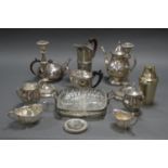 ASSORTMENT OF SILVER PLATE INCLUDING CANDLESTICKS AND TEAPOT.