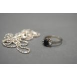 STERLING SILVER SAPPHIRE AND DIAMOND RING. Size P. .11ct diamonds and .3ct Sapphire (total weight