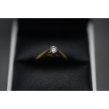 18CT GOLD RING WITH SOLITAIRE DIAMOND. Size K. Total weight 2.1g.