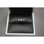 18ct GOLD RING SET WITH 3 DIAMONDS. Size H. Total weight 1.5g.