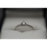 18ct WHITE GOLD AND SOLITAIRE DIAMOND RING. Size L. Total weight 1.5g.