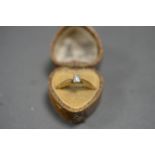 18ct GOLD AND DIAMOND RING. Emerald cut 0.2ct Diamond. Size K. Total weight 3.2g.