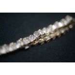 9ct GOLD AND DIAMOND BRACELET. Total of 38 small diamonds making a full carat.