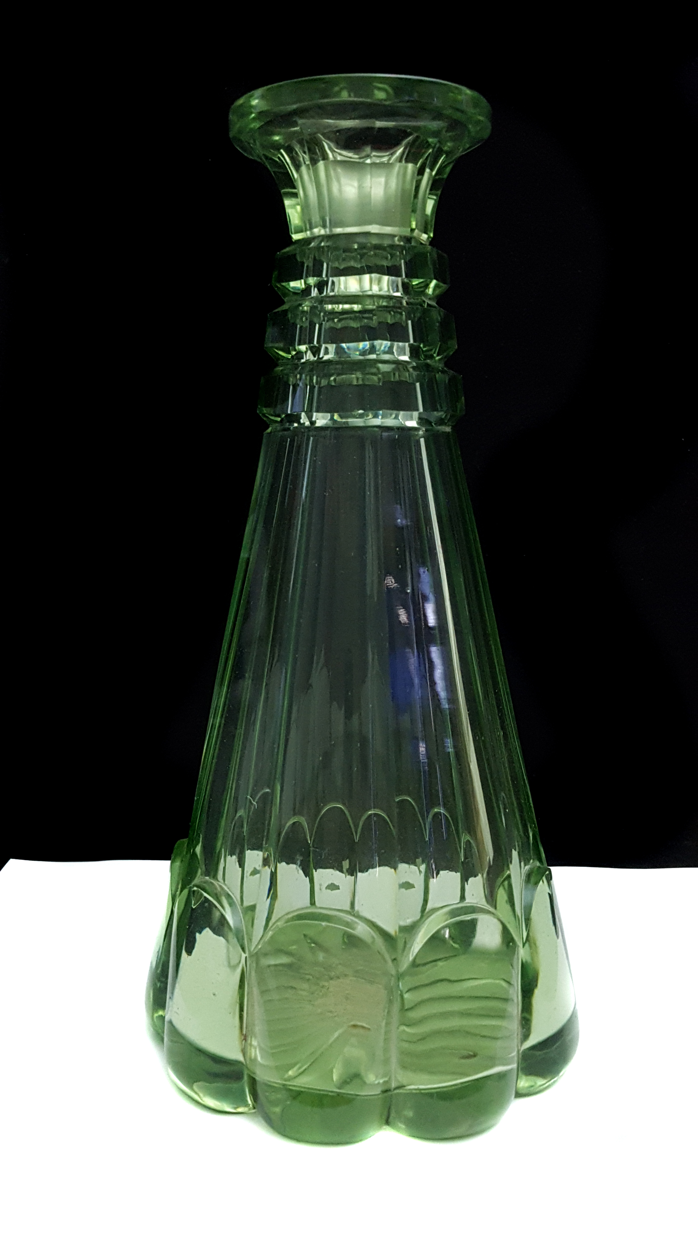 An English chrysoprase green conical decanter, c1840, well cut with faceting, 26.5cm high