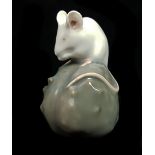 Erik Nielson for Royal Copenhagen porcelain - a figure of a mouse on a grey chestnut shape 511 6.5cm