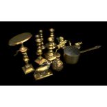 A collection of miniature brass items including a tilt top table; three pairs of candlesticks and