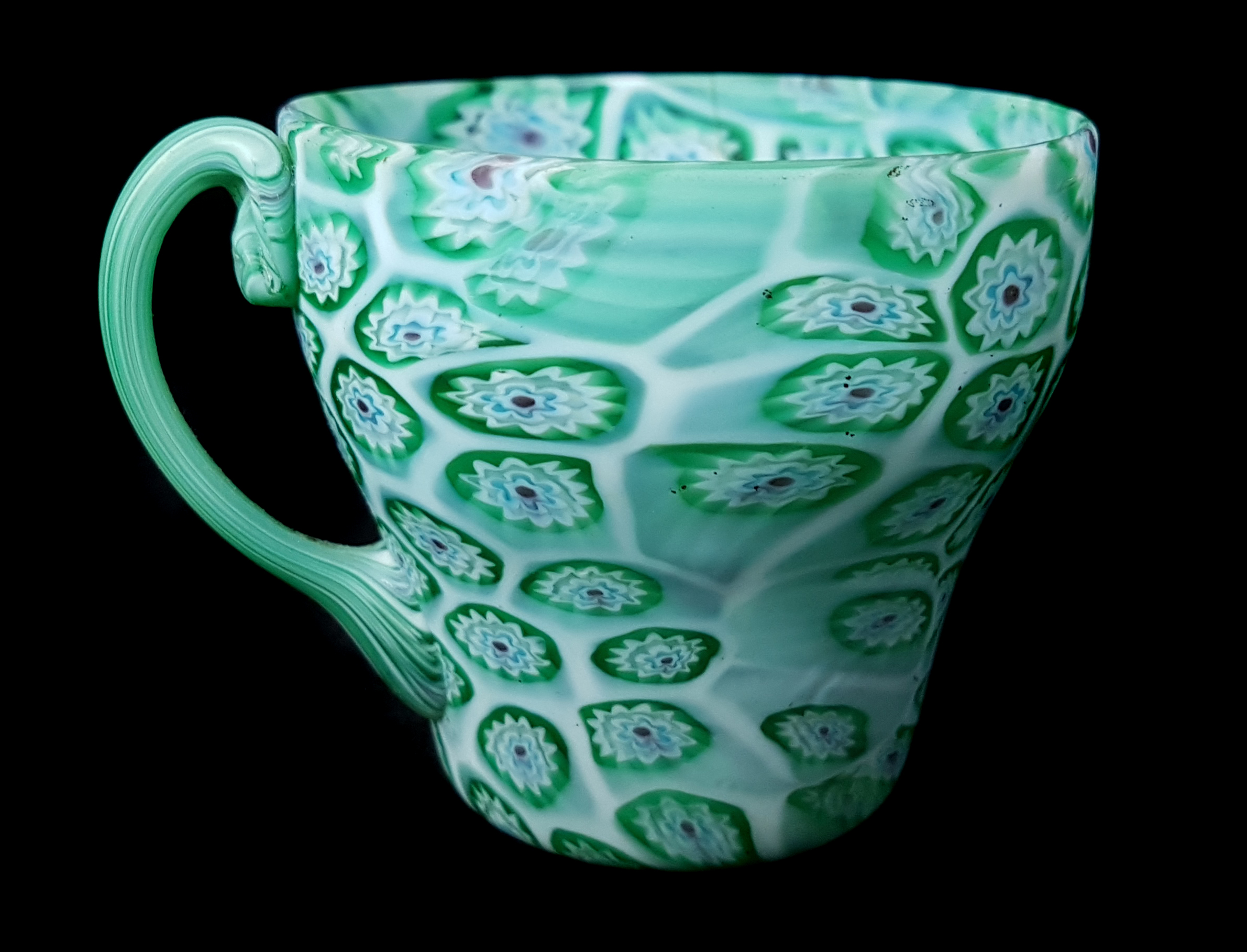 A Tosso brothers millifiori glass teacup and saucer, green and blue canes with red centres on a whit - Image 2 of 3