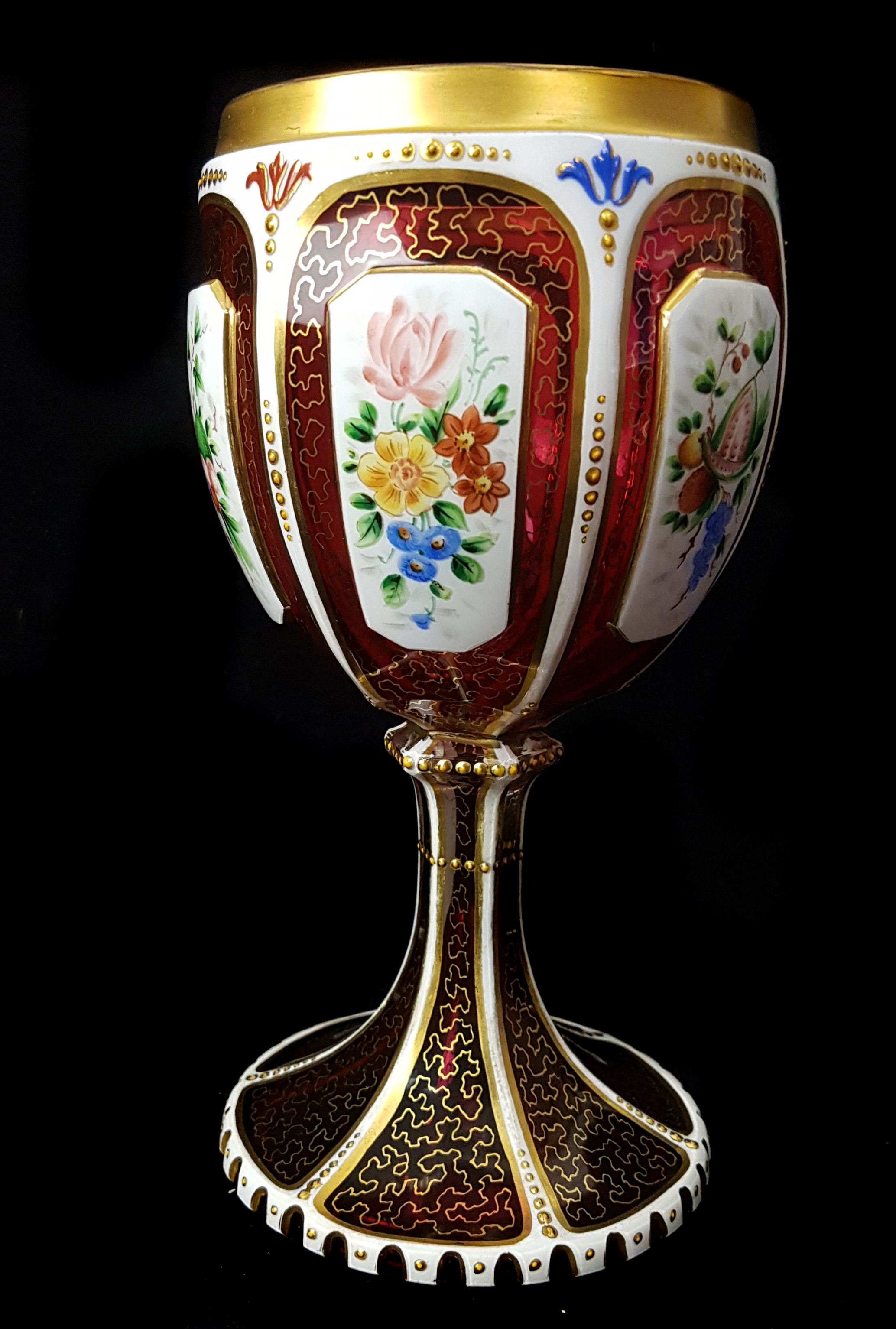 A Bohemian overlay glass goblet, c1850, white cut through to ruby with reserves, enamelled with - Image 2 of 5