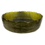 A Kralik glass low bowl, circular, of deep sea green colouration, the exterior with seaweed
