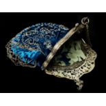 A Continental white metal and cut steel evening bag, the pierced frame cast with putti and foliate