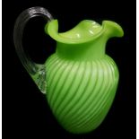 A Stourbridge cased and ribbed green glass jug, trefoil rim with colourless glass strap handle, 16cm