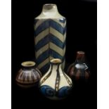 A Winchcombe pottery vase, short bottle form; a Forge Pottery, Downlands Castle vase; and two
