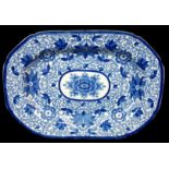 A Staffordshire pottery blue printed meat plate, overall printed with stylised lotus flower with