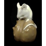 Erik Nielson for Royal Copenhagen porcelain - a figure of a mouse on a brown chestnut, shape 511,