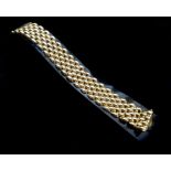 An Italian 9ct yellow gold flat link bracelet, of seven rows, 20cm long, 31 grs