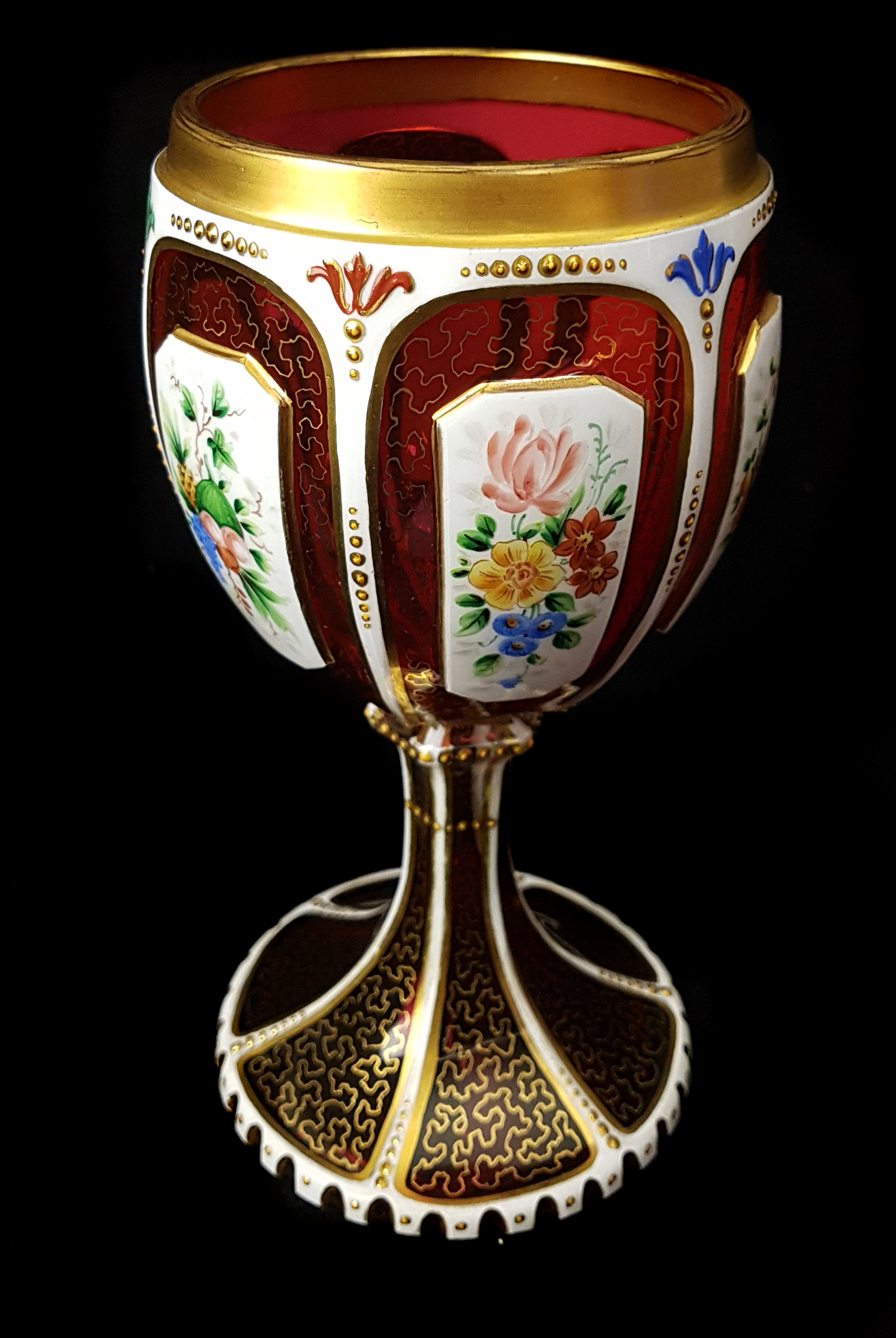A Bohemian overlay glass goblet, c1850, white cut through to ruby with reserves, enamelled with - Image 5 of 5
