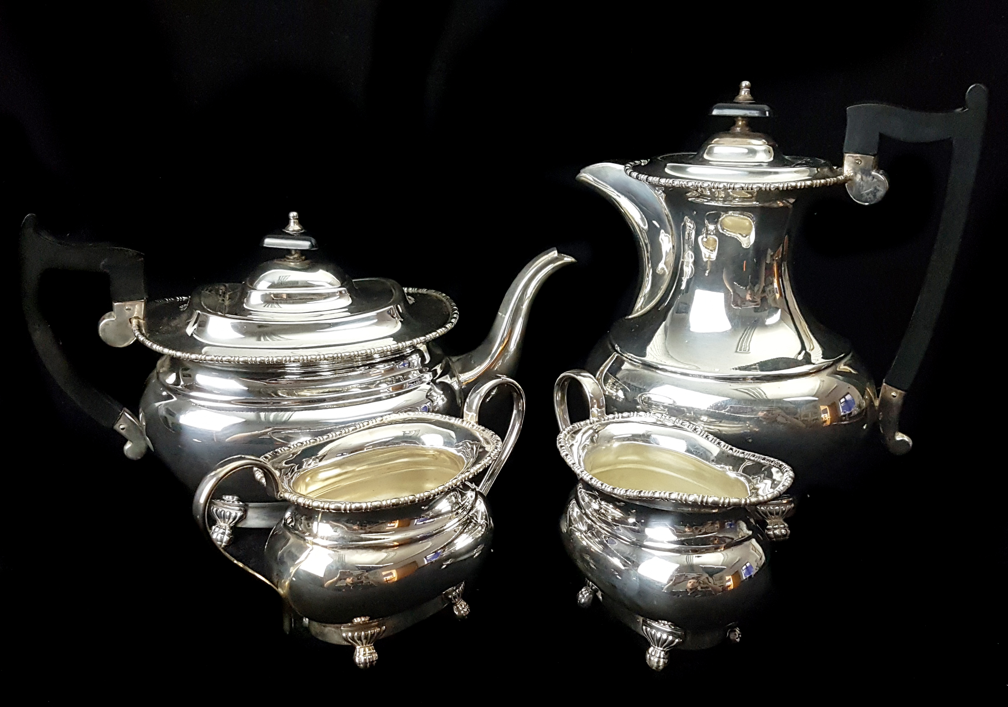 A sliver plated four piece Viners tea service, comprising teapot, hot water jug/coffee pot, milk jug
