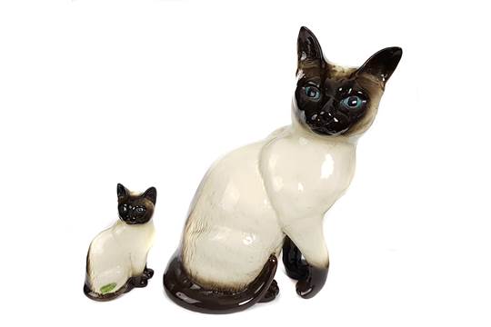 Two Beswick pottery figures of Siamese Cats, one stamped shape No.188, 25cm high; the other with