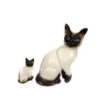 Two Beswick pottery figures of Siamese Cats, one stamped shape No.188, 25cm high; the other with