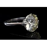 A 4.7ct solitaire diamond ring, round brilliant cut, set in a platinum coronet style setting, J-K