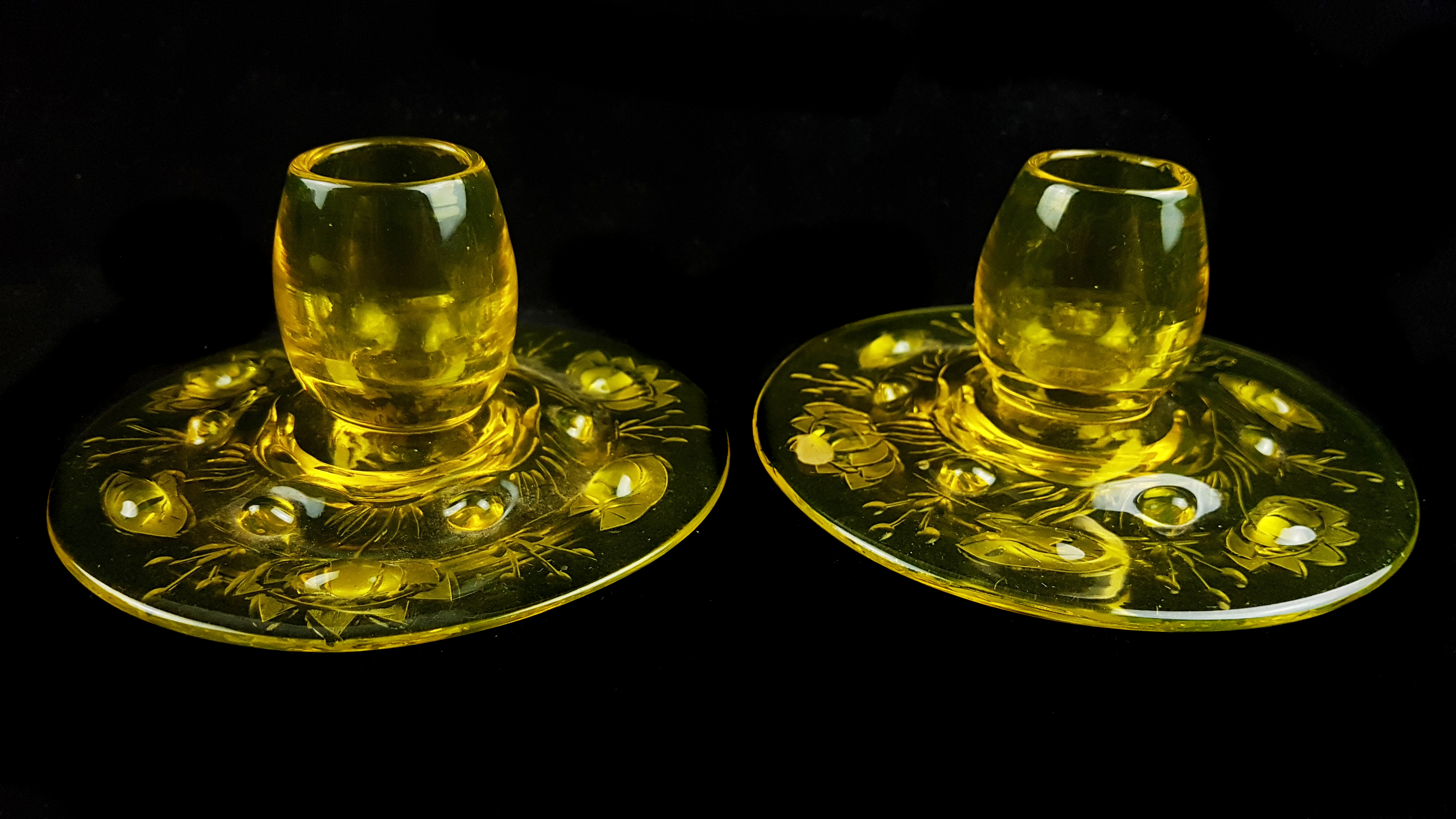 A pair of Webbs Gay glass dwarf candlesticks, yellow amber colour, the circular foot moulded and cut