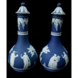 A pair of Wedgwood vases and covers or Perfumieres, dark blue jasper sprigged with classical fihures