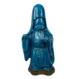 A Japanese porcelain figure of Fukurokuju, the whole covered in bright turquoise glaze, the deity