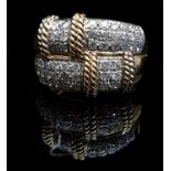 An 18ct yellow gold and diamond ring, composed of two sections of pave diamonds banded with gold
