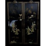 A pair of Chinese black laquer panels, 23cm max (2)