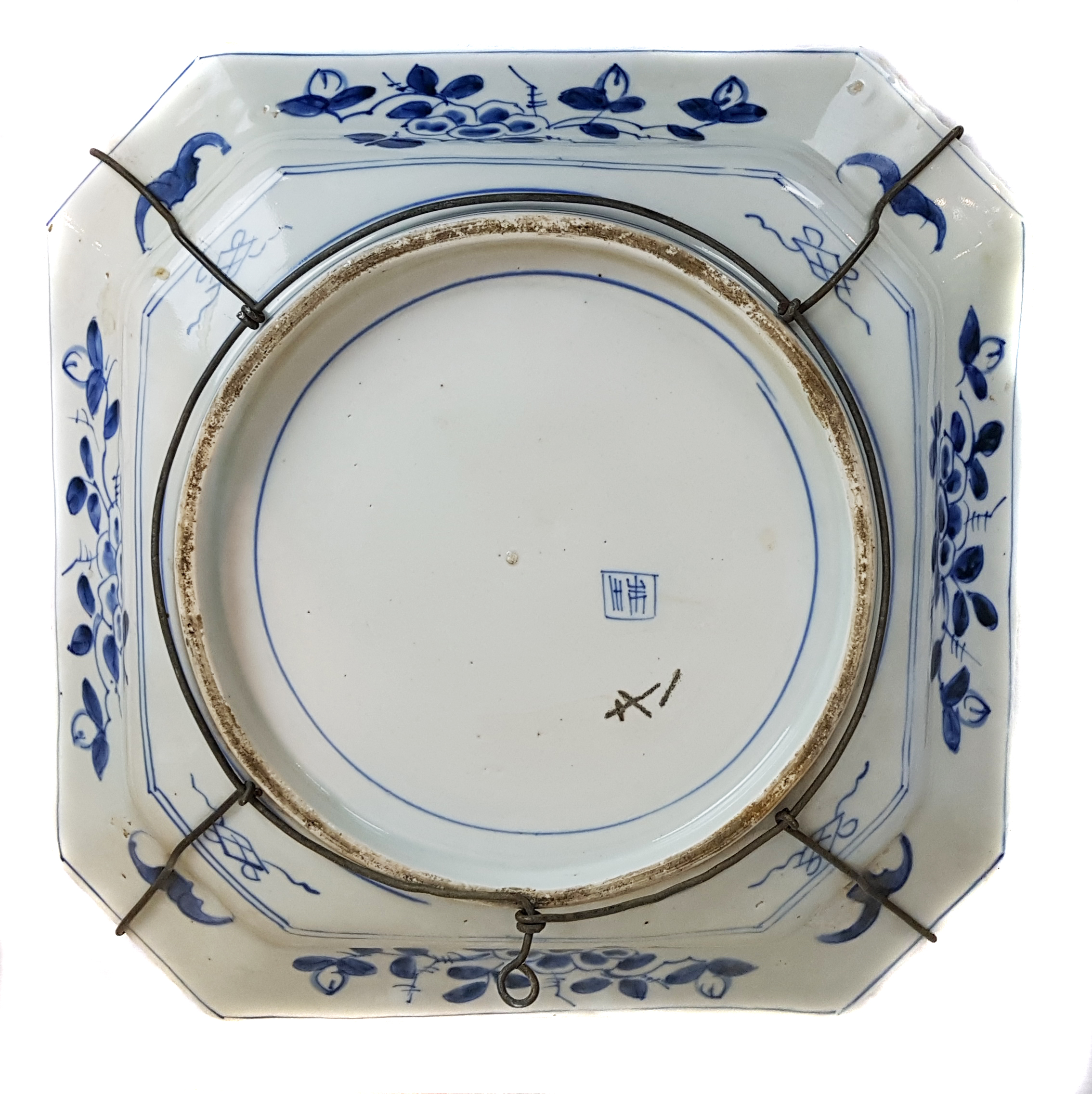 A Japanese porcelain blue and white dish, of canted square form, decorated in blue and white with - Image 2 of 3