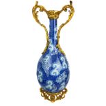 A Chinese blue and white porcelain bottle vase with ormolu mounts, the vase painted with dragons