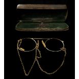 A pair of yellow metal antique pince-nez spectacles, in a steel case (2)