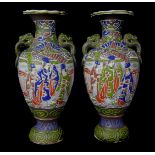A pair of Japanese Satsuma pottery vases, decorated with immortals, 21cm high (2)