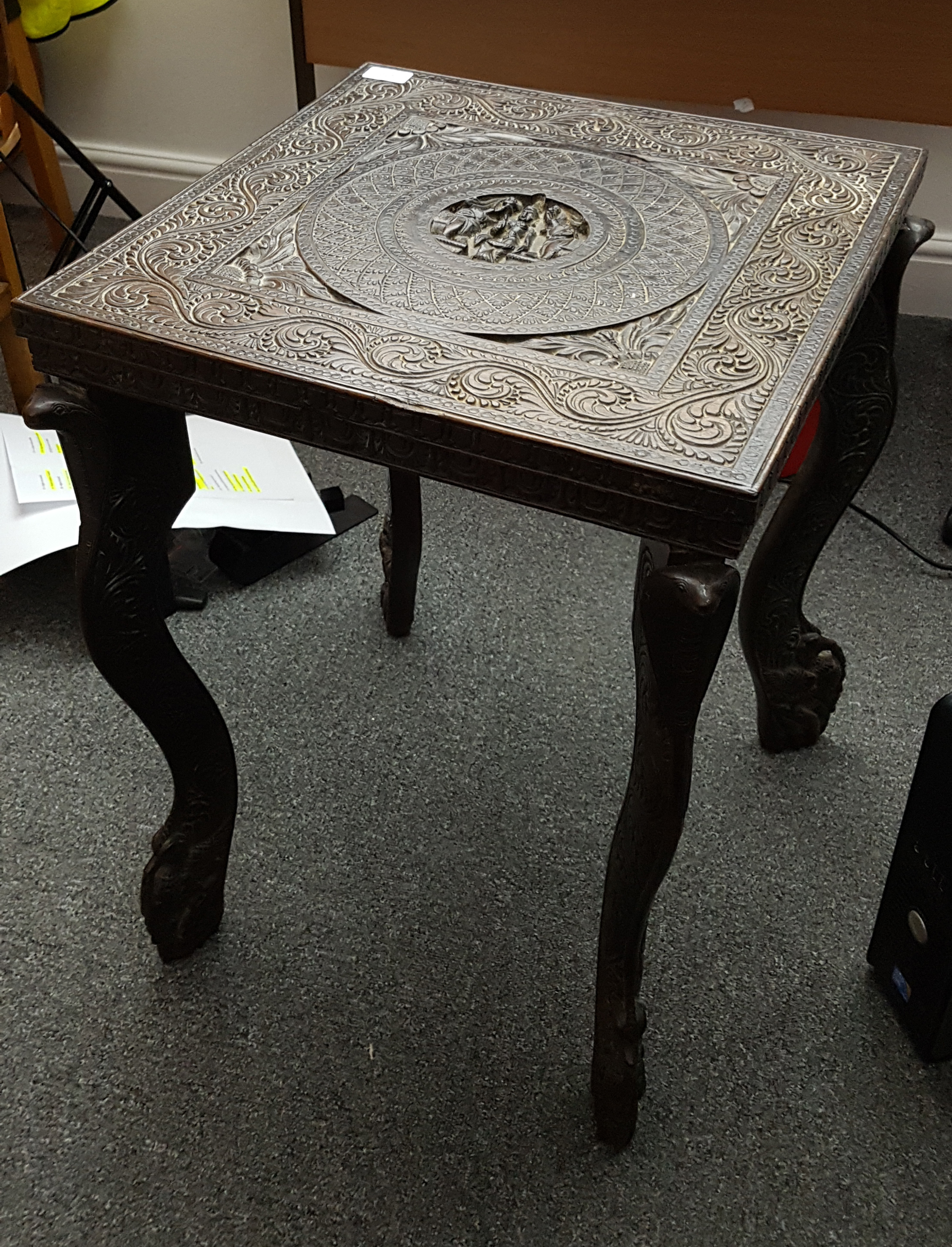 An Anglo-Indian carved hardwood table, the square topped table carved with central roundel of a - Image 2 of 3
