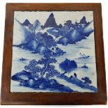 A Chinese hardwood low stand, set with a Chinese blue and white porcelain square panel to top,
