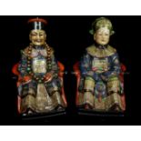 Two Chinese pottery ancestor figures, seated on thrones, polychrome decorated, 29cm high (2)