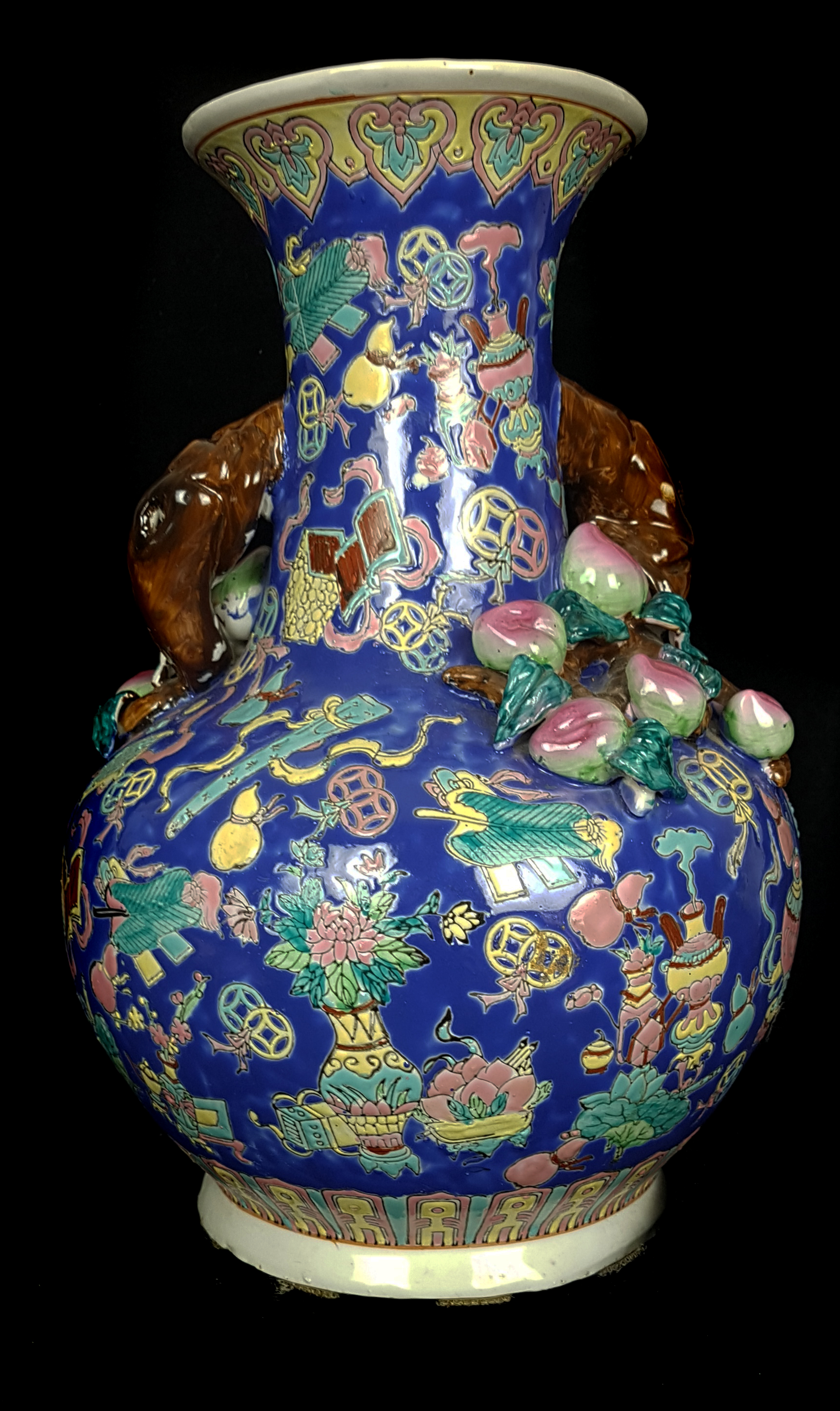 A Chinese porcelain peach vase, of squat bottle form, applied with fruiting branches, on a ground - Image 2 of 3