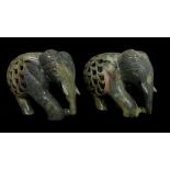 Two Indian soapstone elephant figures, the back pierced to reveal a baby elephant to interior,