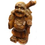 A large Chinese carved wood figure of the laughing buddha, holding staff and syche, 77cm high