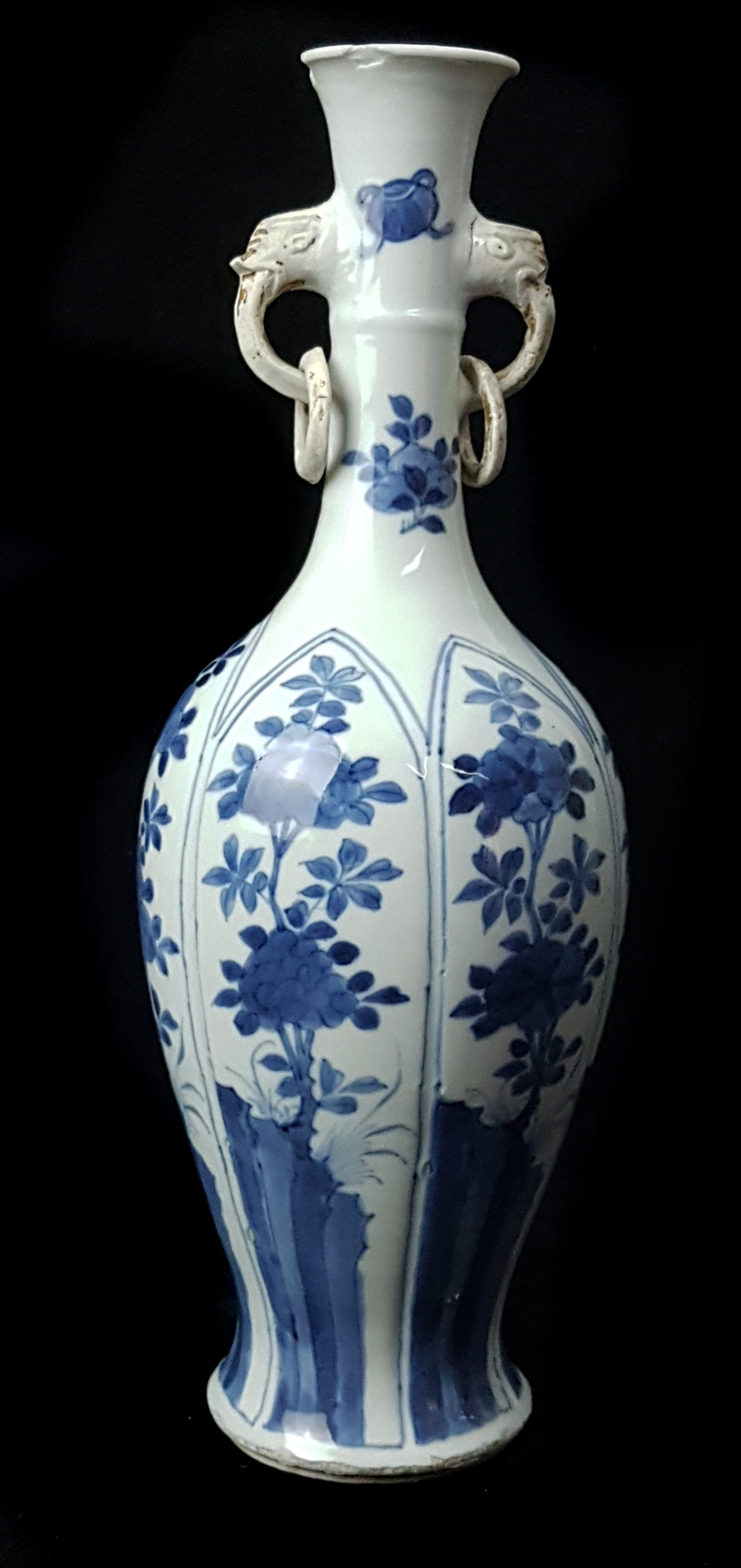 A Chinese blue and white porcelain two handled ring neck bottle vase, the slender neck applied